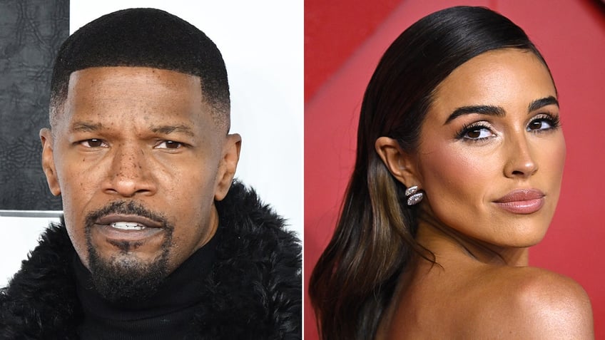 Jamie Foxx with a furry jacket on the carpet split Olivia Culpo in front of a red back drop looks over her shoulder