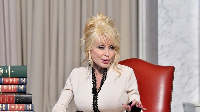 Dolly Parton urges the Indiana governor not to cut funding for her Imagination Library initiative, which benefits children.