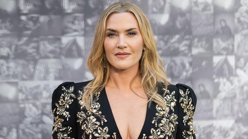 Kate Winslet in a black dress with jewel embellishments