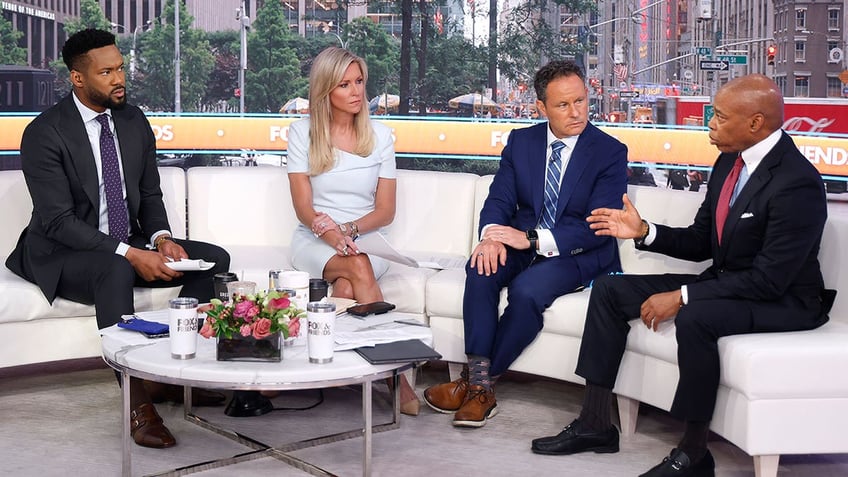 NEW YORK, NEW YORK - JUNE 16: New York City Mayor Eric Adams joins Fox anchors Lawrence Jones, Ainsley Earhardt and Brian Kilmieade during "Fox & Friends" at Fox News Channel Studios on June 16, 2025 in New York City. 