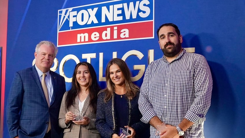 FOX News Media President Jay Wallace with winners of the Unsung Hero Award