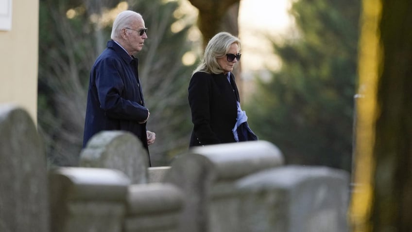 Joe and Jill Biden walking through churchyard