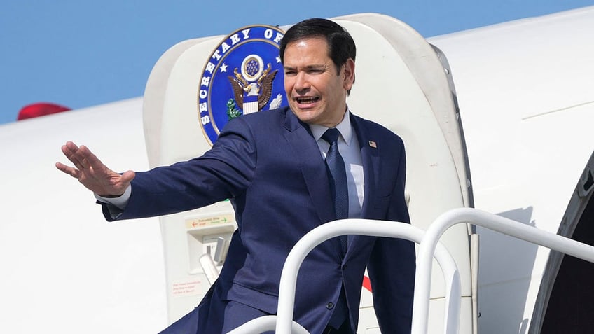 TOPSHOT - US Secretary of State Marco Rubio boards a plane en route to El Salvador at Panama Pacifico International Airport in Panama City on February 3, 2025. Rubio is in Panama on a two-day official visit. 