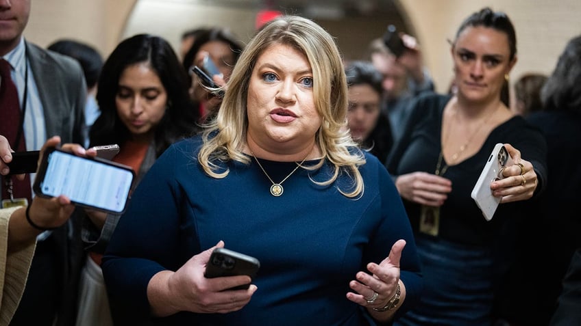 Rep. Kat Cammack amid press in hallway