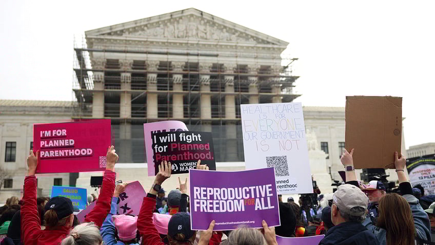 Pro-Planned Parenthood protesters outside Supreme Court