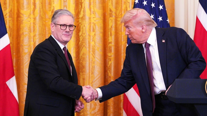 Britain's Prime Minister Keir Starmer, left, and President Donald Trump shake hands at a joint press conference in the East Room at the White House Feb. 27, 2025, in Washington.