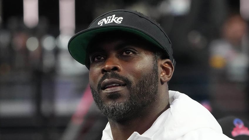 Michael Vick looks on field