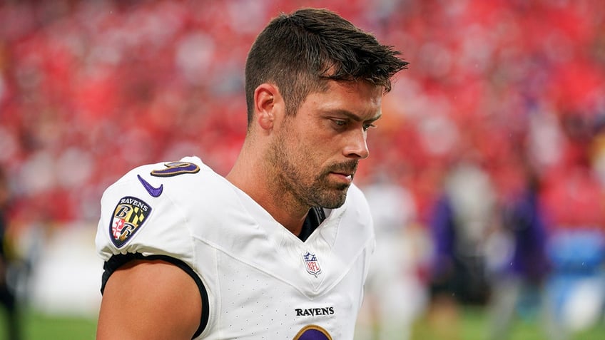 Justin Tucker looks on