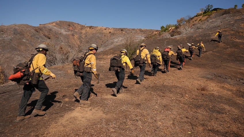 Firefighters work on the fires