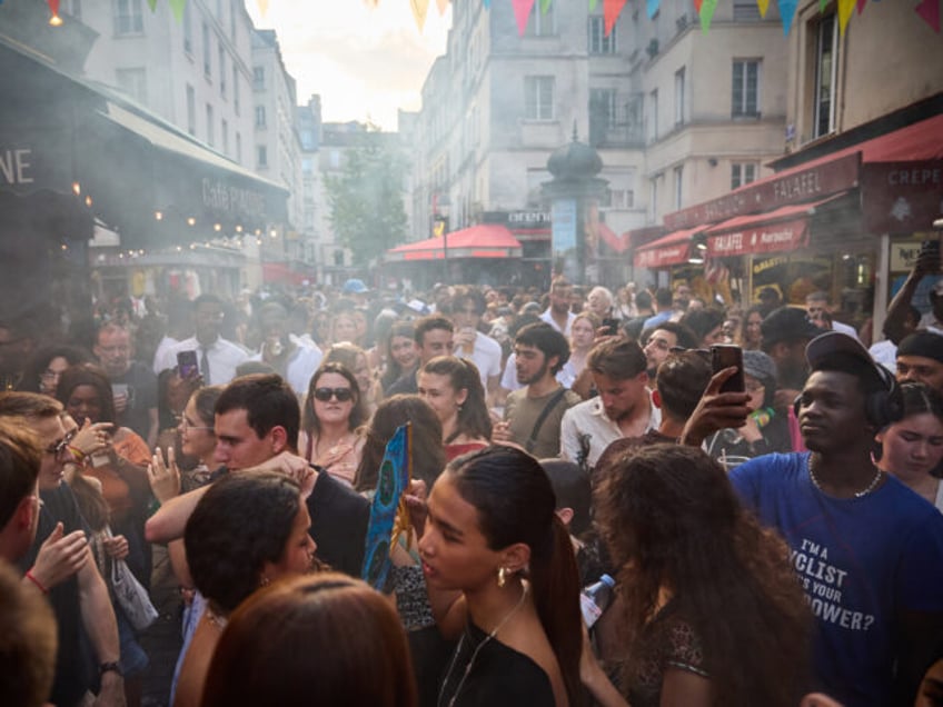 PARIS, FRANCE - JUNE 21: Revellers dance in the street during Fete De La Musique 2025 as b