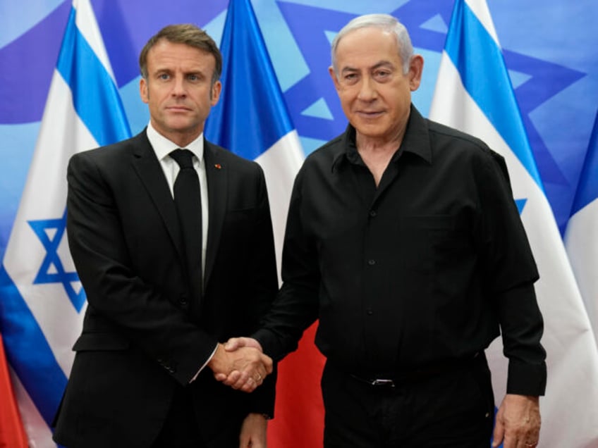 Israeli Prime Minister Benjamin Netanyahu, right, welcomes French President Emmanuel Macro