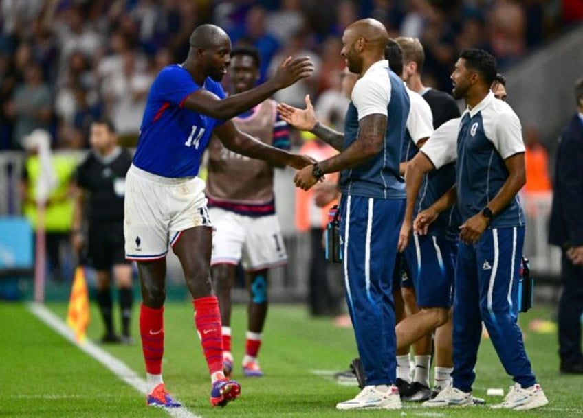 Jean-Philippe Mateta celebrates scoring one of his two goals in France's 3-1 win over Egyp