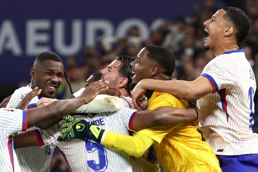 France players celebrate their quarter-final victory via a penalty shoot-out against Portu