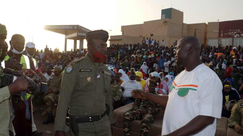 NIAMEY, NIGER - DECEMBER 22: Members of the National Council for the Protection of the Homeland (CNSP) and citizens mark the departure of French soldiers gather to participate together in celebrations at the military base in Niamey, Niger on December 22, 2023. The remaining 154 French soldiers in Niger, have left the country. In a ceremonial departing French soldiers handed over military base in Niamey, to Nigerien Military Forces. (Photo by Balima Boureima/Anadolu via Getty Images)