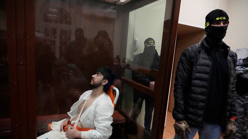 Beaten Moscow concert attacker in Russian court box