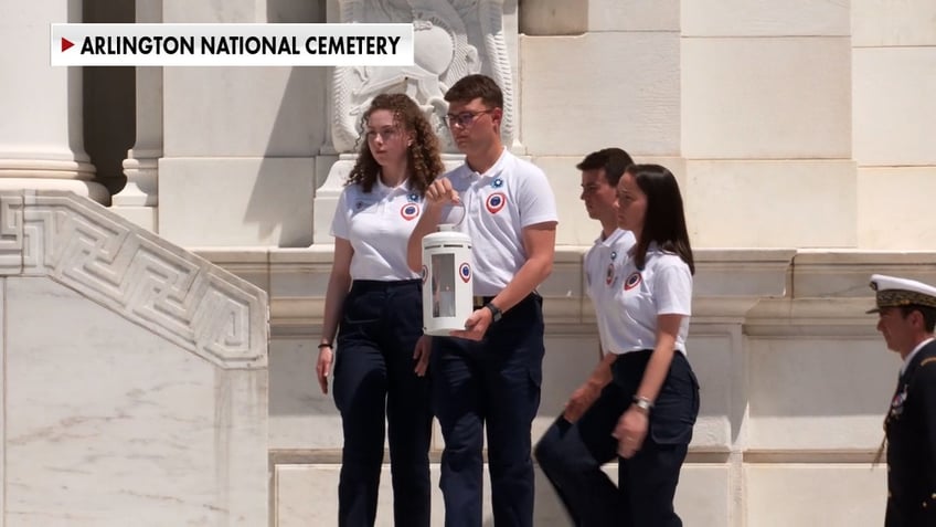 French ambassadors presenting flame from France