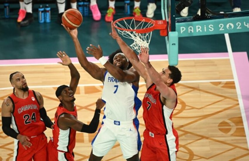 Guerschon Yabusele (2ndR) led France with a team-best 22 points in the win over Canada