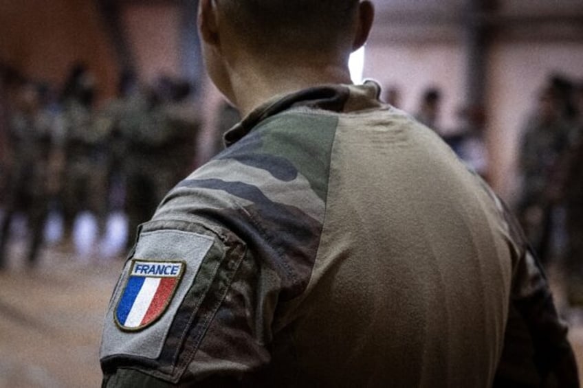 france softens tone on niger coup