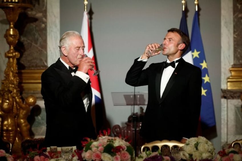 Britain's King Charles and French President Emmanuel Macron toast their countries' friends