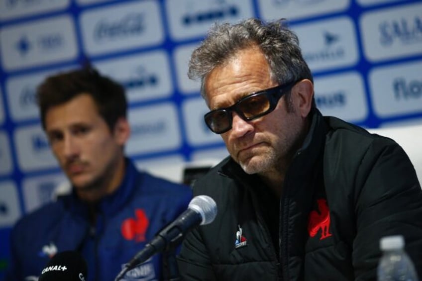 France coach Fabien Galthie (R) and captain Baptiste Serin (L) faced a difficult press con