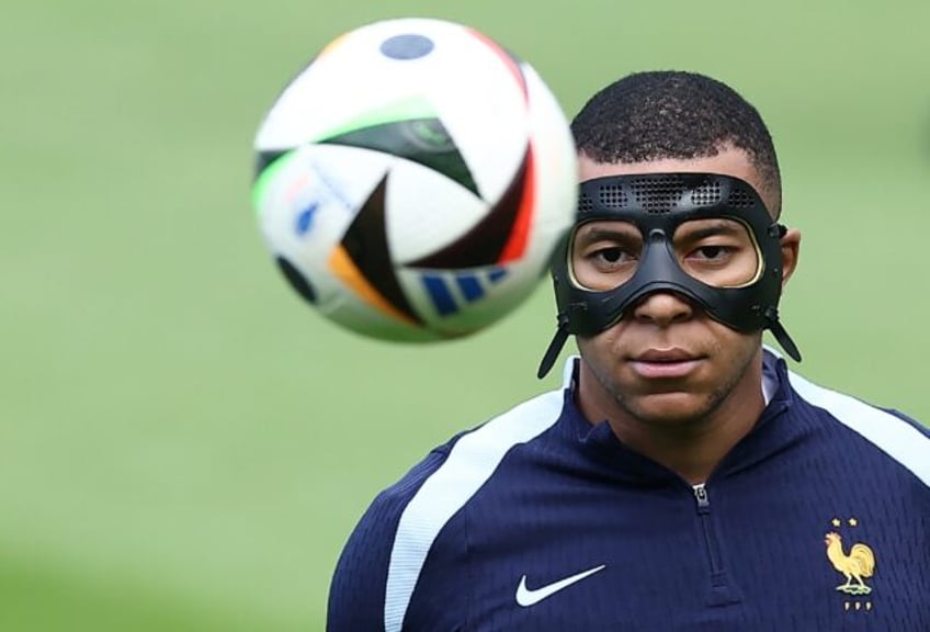 Kylian Mbappe sports a mask in training on Sunday. Could the France captain play against P