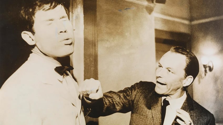 Frank Sinatra punching a man.