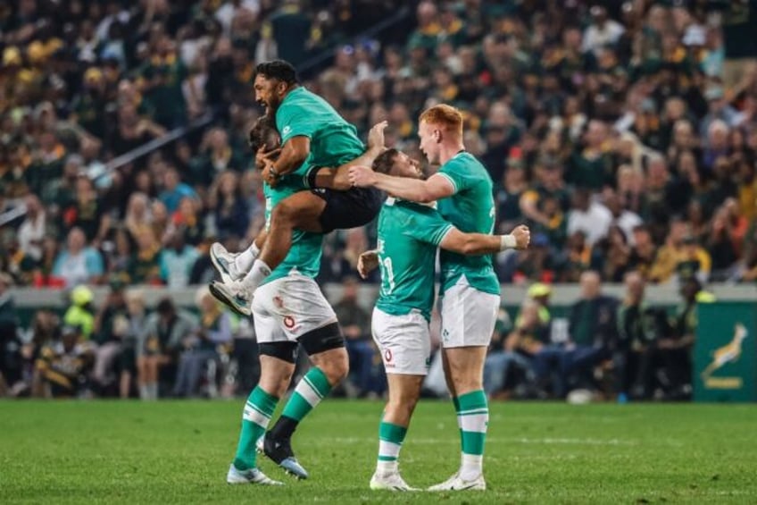 Ciaran Frawley (R) celebrates Ireland's win