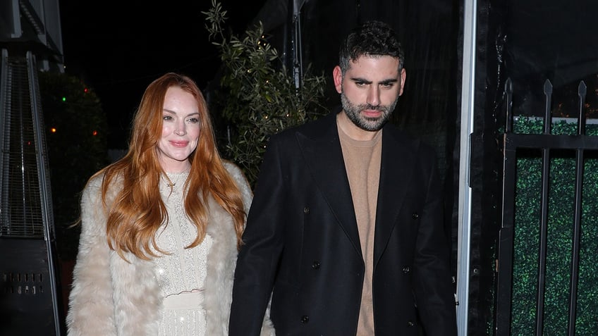 Lindsay Lohan holding hands with Bader Shammas