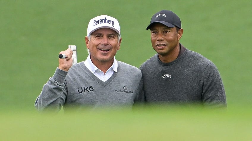 Tiger Woods hugs Fred Couples