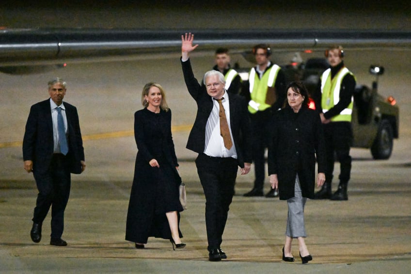 freed julian assange lands in australia after 14 year legal battle