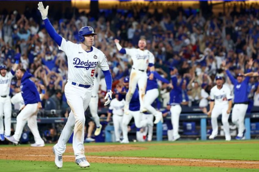 Freddie Freeman's World Series grand slam walk-off baseball has sold for $1.56 million at