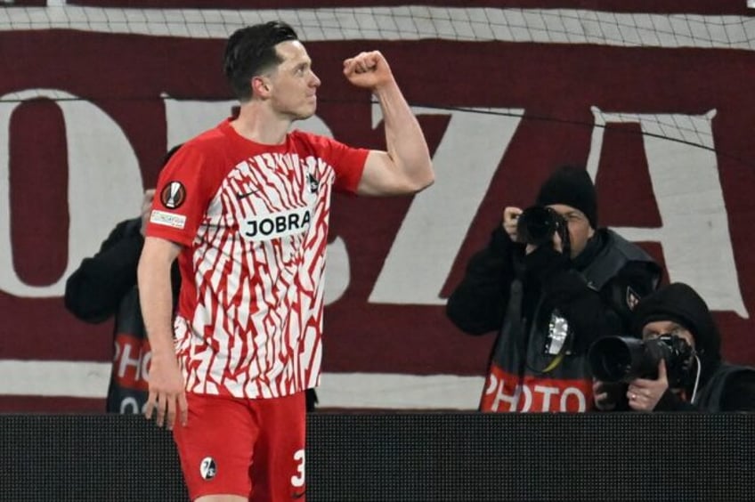 Freiburg forward Michael Gregoritsch celebrates after scoring the only goal in a 1-0 win o