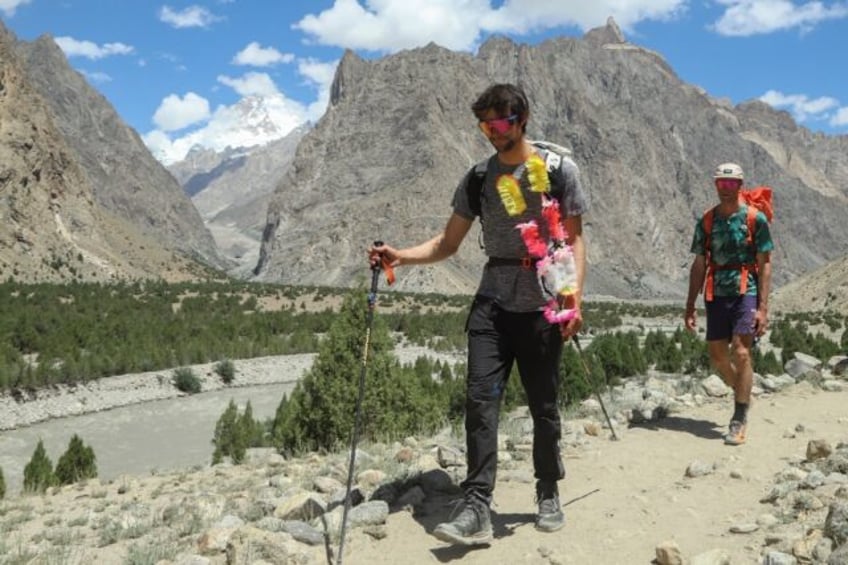 French climber Benjamin Vedrines (left) returns to Hushe village in Pakistan's Gilgit-Balt