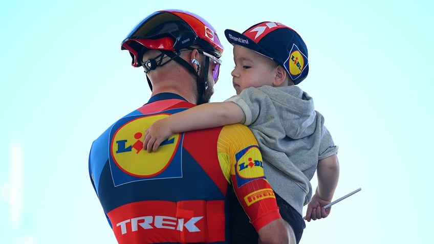 Julien Bernard holds son