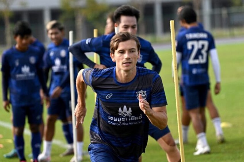 French footballer Antoine Lemarie (front) trains with Cambodian Premier League team Boeung Ket FC at the Morodok Techo National Stadium in Phnom Penh