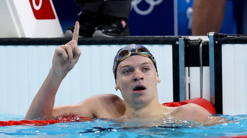 Leon Marchand of Team France celebrates after winning gold in the Men's 200m Butterfly Final on day five of the Paris Olympics.