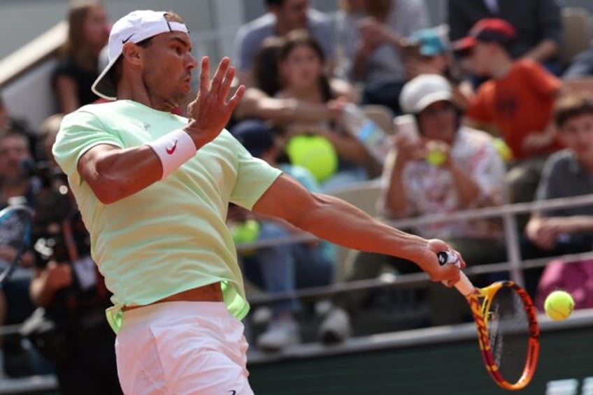 Crowd favourite: Rafael Nadal practices at the French Open