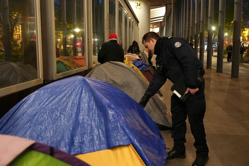 french police clear migrant camps out of paris in alleged pre olympics clean