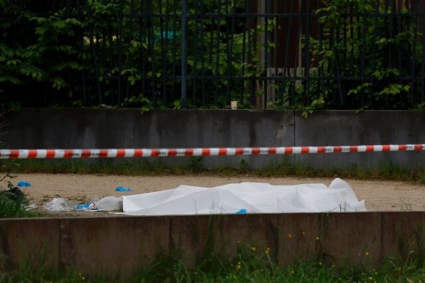 A body covered with a sheet after a double shooting in Sevran, northeast of Paris, on Sund