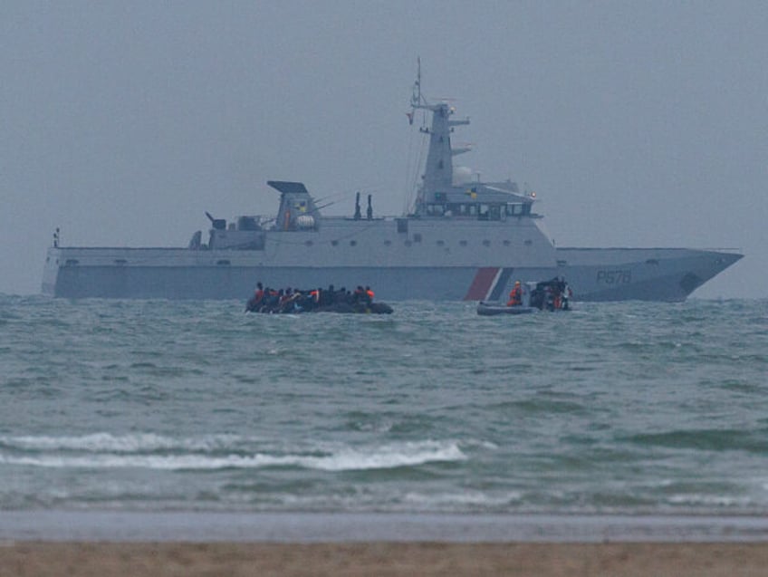 GRAVELINES, FRANCE - JULY 02: A Maritime Gendarmerie rib approaches a small boat full of m