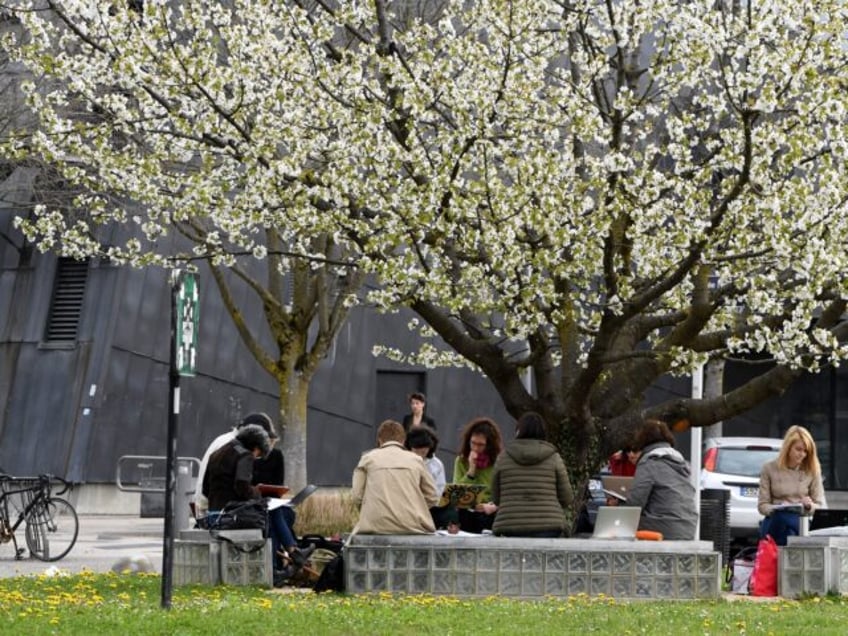 Students work outside Stendhal University of Universite Grenoble Alpes (UGA) blocked by st