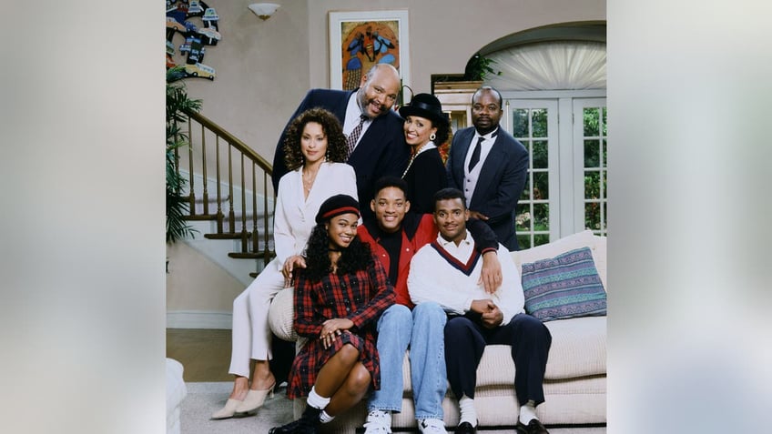 Tatyana Ali as Ashley Banks; Will Smith as William 'Will' Smith; Alfonso Ribeiro as Carlton Banks; (back l-r) Karyn Parsons as Hilary Banks; James Avery as Philip Banks; Daphne Reid as Vivian Banks; Joseph Marcell as Geoffrey