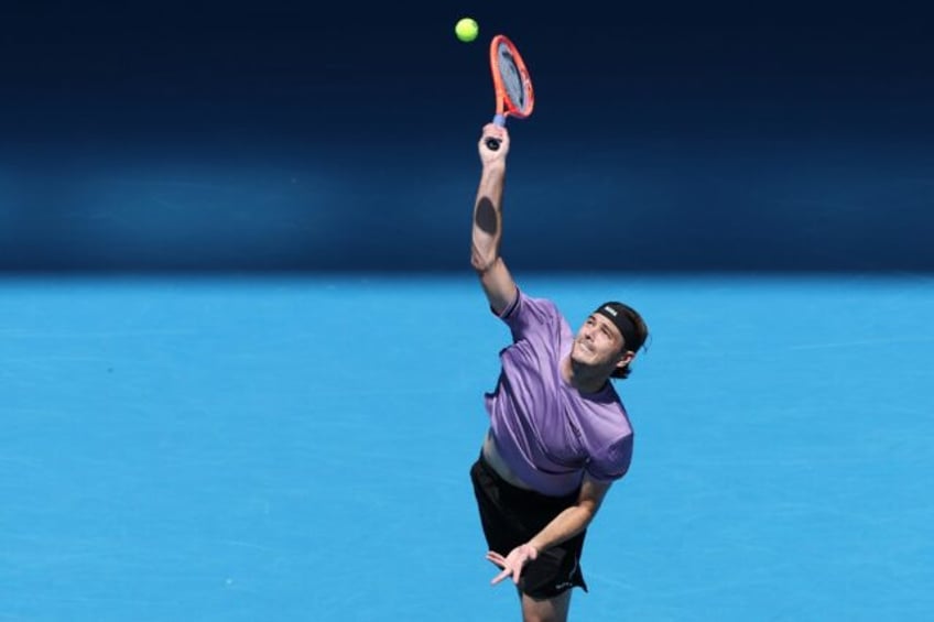 Fourth seed Taylor Fritz surged into the Australian Open second round