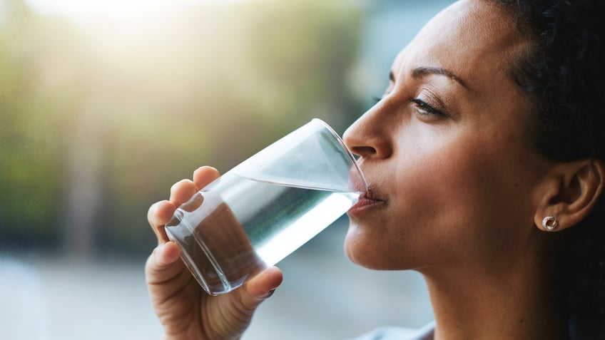 Woman drinking glass of water