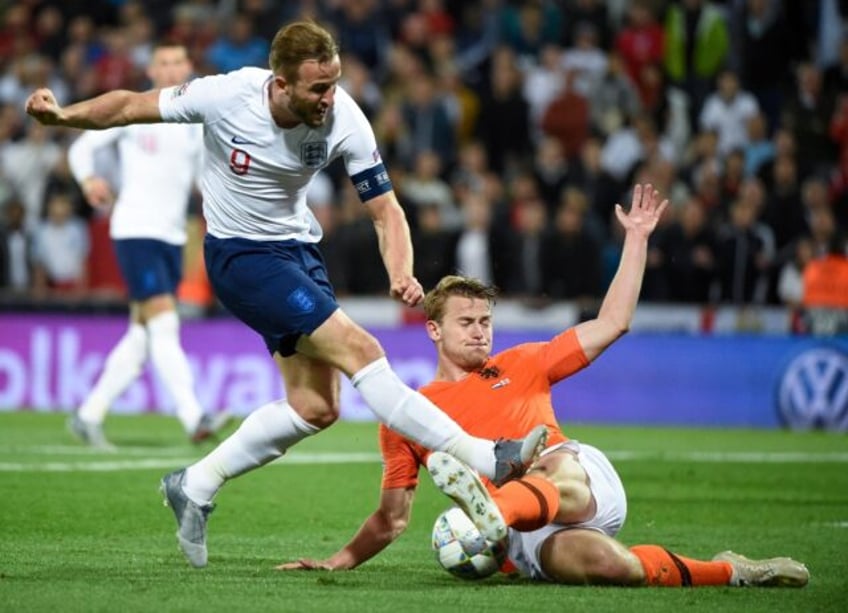 Matthijs de Ligt slides in to challenge Harry Kane during the last meeting between England