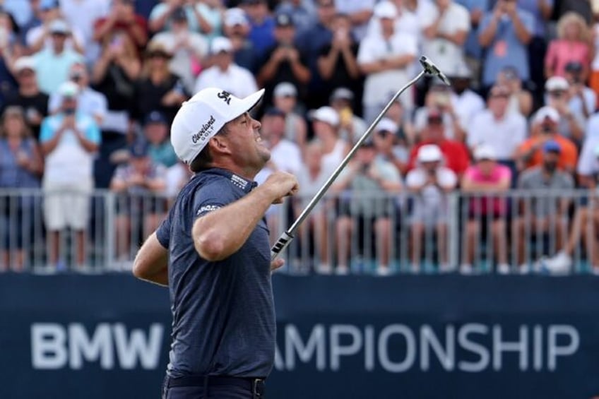 Keegan Bradley of the United States celebrates on the 18th green after winning the BMW Cha