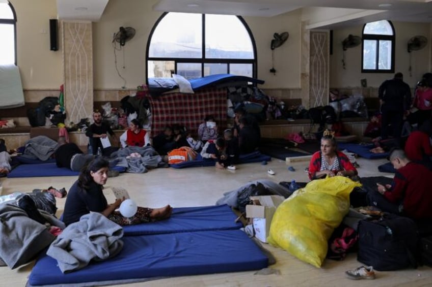 Syrians from the Alawite minority take shelter at a school in Lebanon's Masaoudiyeh villag