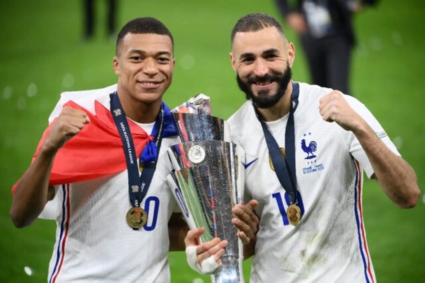 Kylian Mbappe (left) and Karim Benzema (right) celebrate after France beat Spain 2-1 to wi