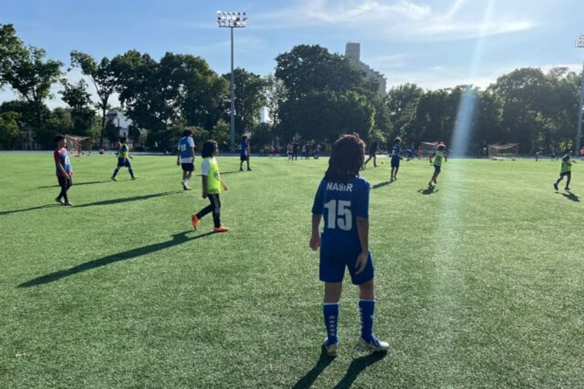 Children play football at the 5 Star Soccer Academy, run by Honduran footballer Nahun Rome