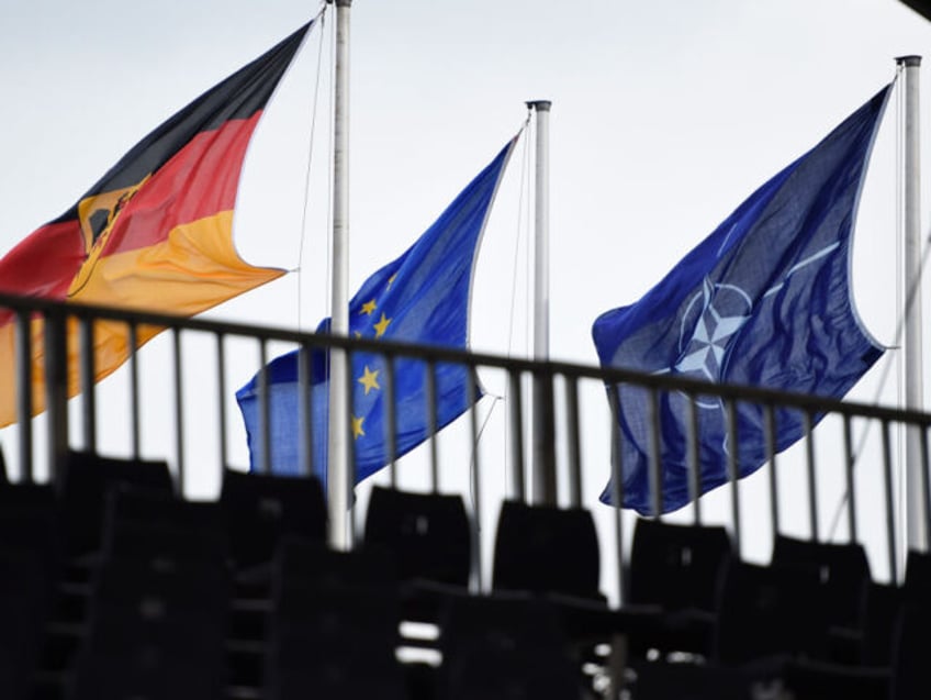 MUNSTER, GERMANY - OCTOBER 10: The Flags of Germany, the European Union and the NATO (North Atlantic Treaty Organization) hang during a military exercise on October 10, 20187 near Munster, Germany. Today's exercises, dubbed "Operation Allied Powers", involve an infantry tank battalion, air support and artillery, and are part of …